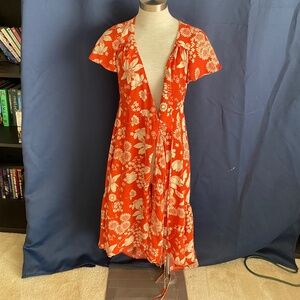 Orange dress with white floral design